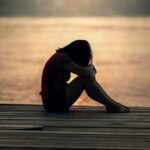 A woman sitting alone in depression
